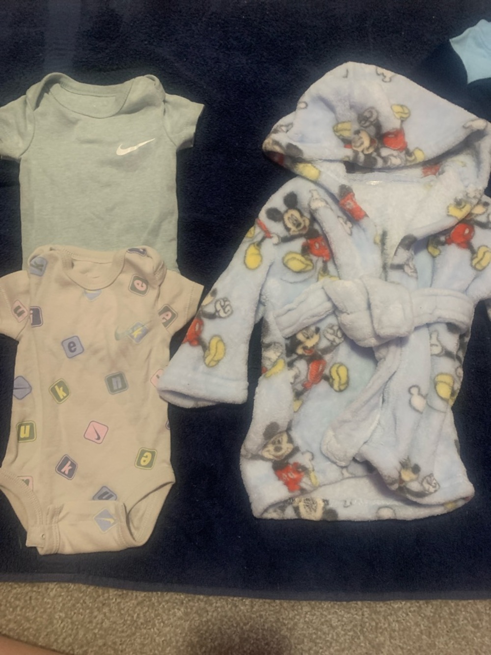 2 Nike onesies and 1 Mickey Mouse soft robe